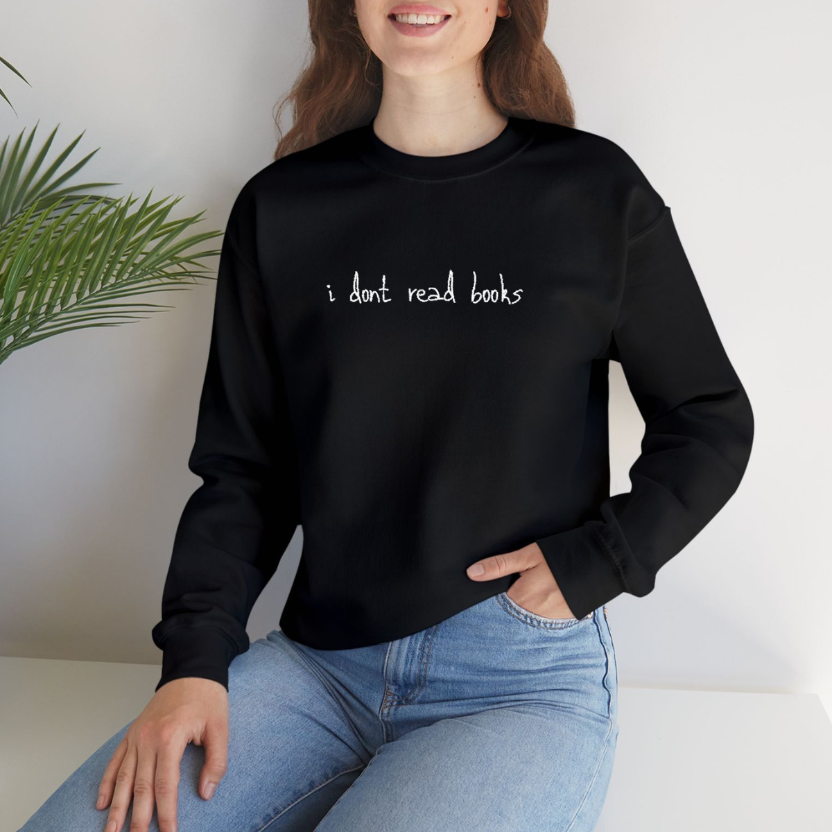 I dont read books black crewneck merch on model from A Philly Fairytale by Fair Darling